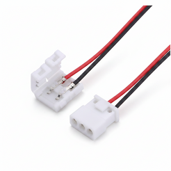Two white plastic electrical connector blocks with red and black wires attached, shown on a plain white background.