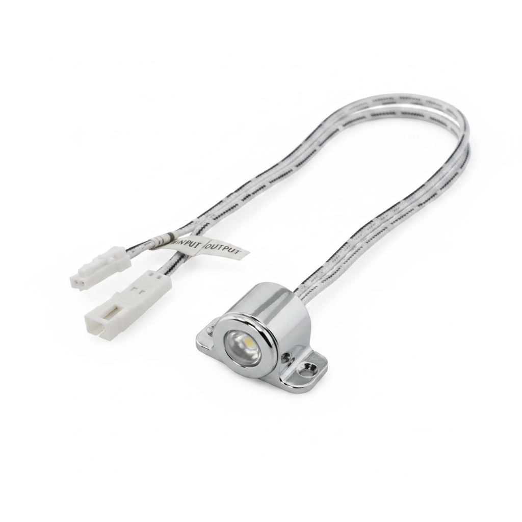 A small cylindrical chrome metal component with attached gray and white cables and white connector ends, shown on a plain white background.
