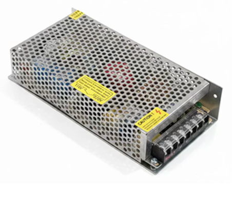 A metal power supply unit with a perforated silver aluminum casing, yellow warning labels, and a terminal strip on the side, photographed on a white background.